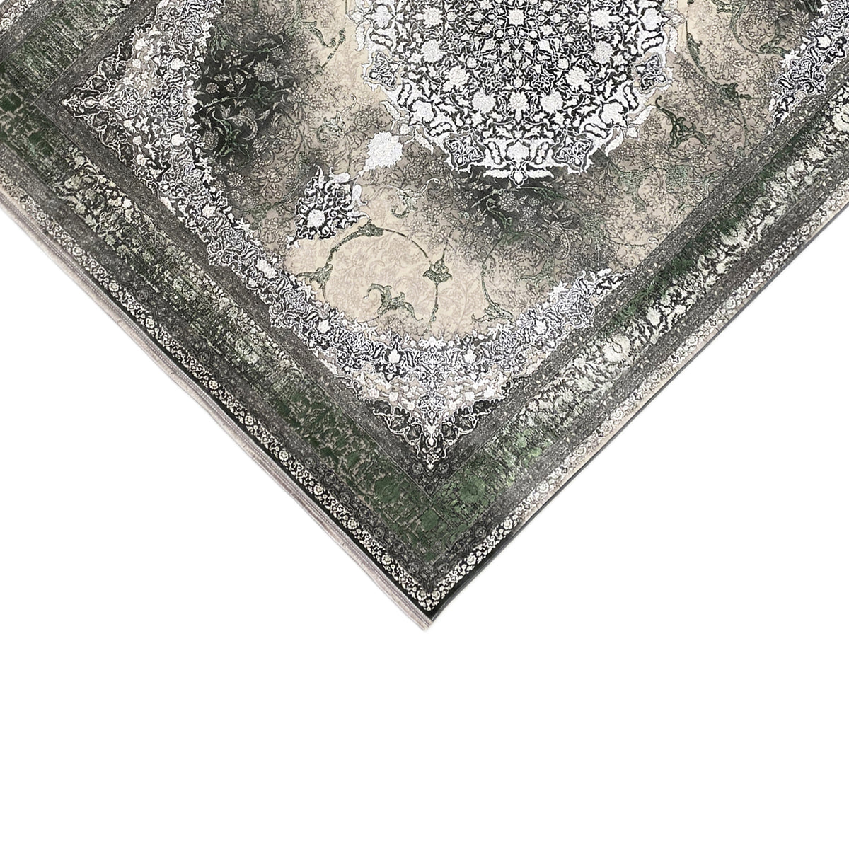 Tappeto Waldgeist 170x240 cm visto dall’angolo: verde scuro, ornamenti chiari e bordura