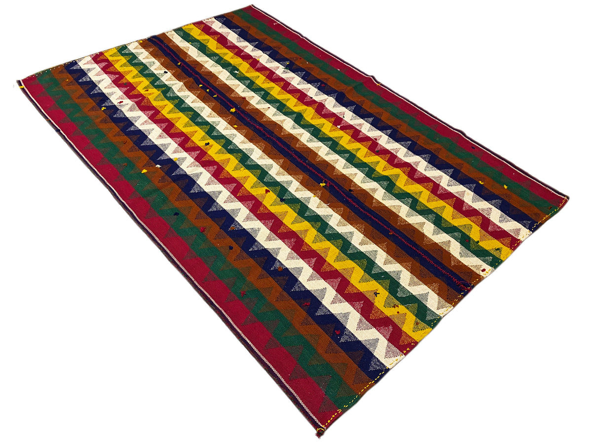 Tappeto jajim inclinato con strisce zigzag multicolori e frange