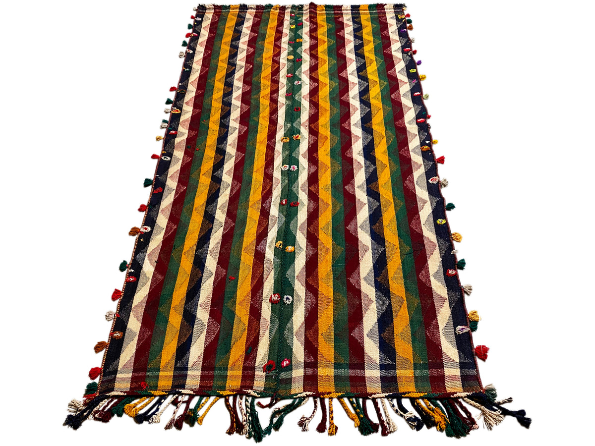 Tappeto Jajim colorato con motivi a zigzag e righe multicolori, accenti verdi e frange