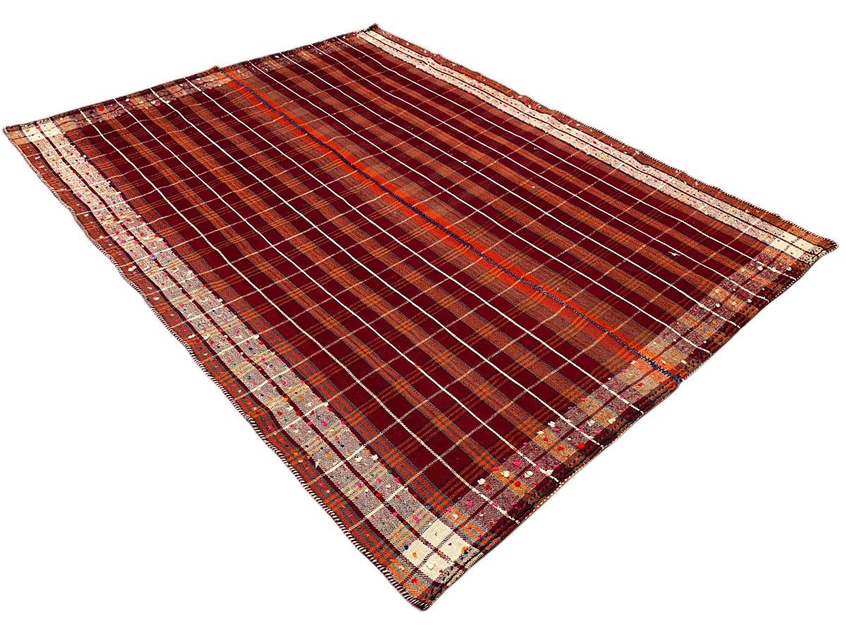 Tappeto a quadri color bruno-rossastro con bordi a righe beige e motivo a contrasto