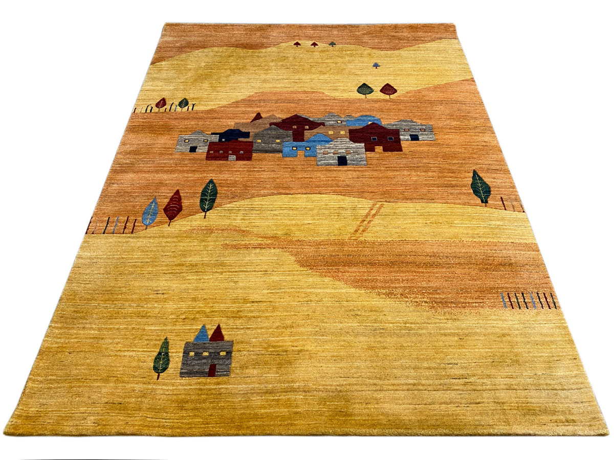 Teppich mit Bordüre oben und zentralem Dorfmotiv in Blau- und Rottönen