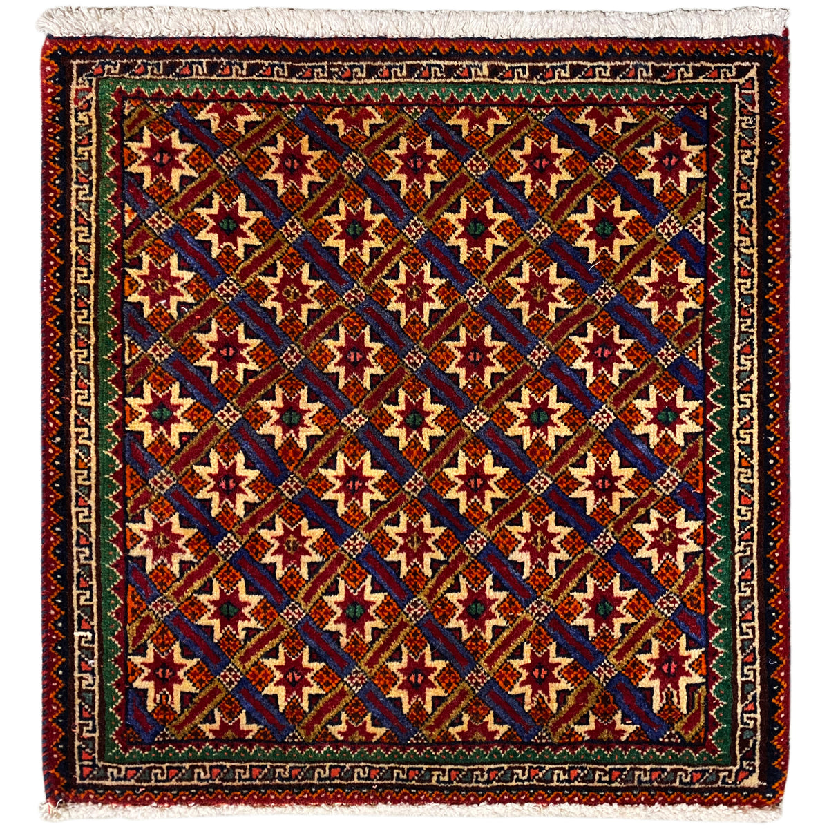 Tappeto Poshti 62x52 cm con motivo geometrico, multicolore e frange.