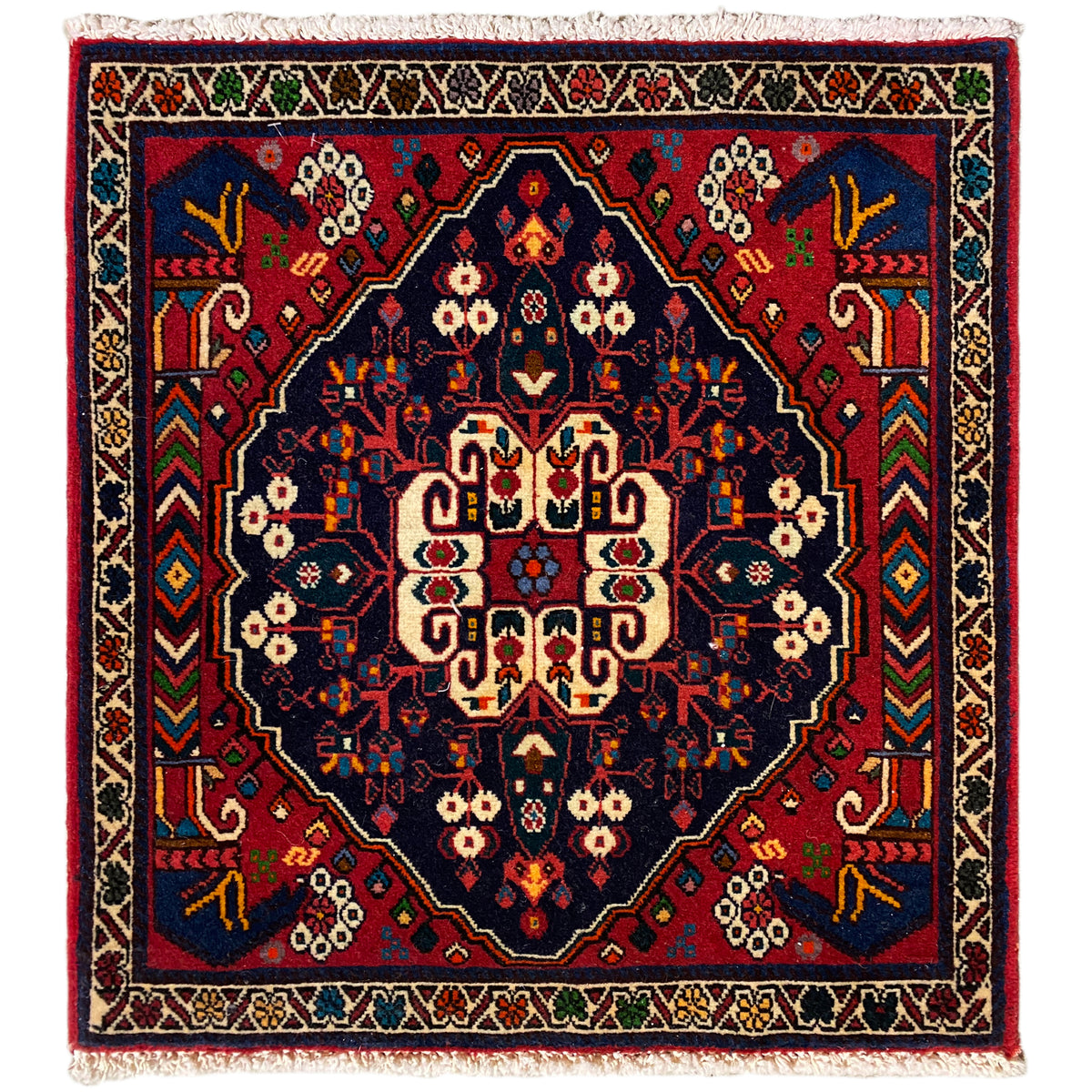 Tappeto Poshti 66x62 cm: motivo geometrico in blu/rosso con frange