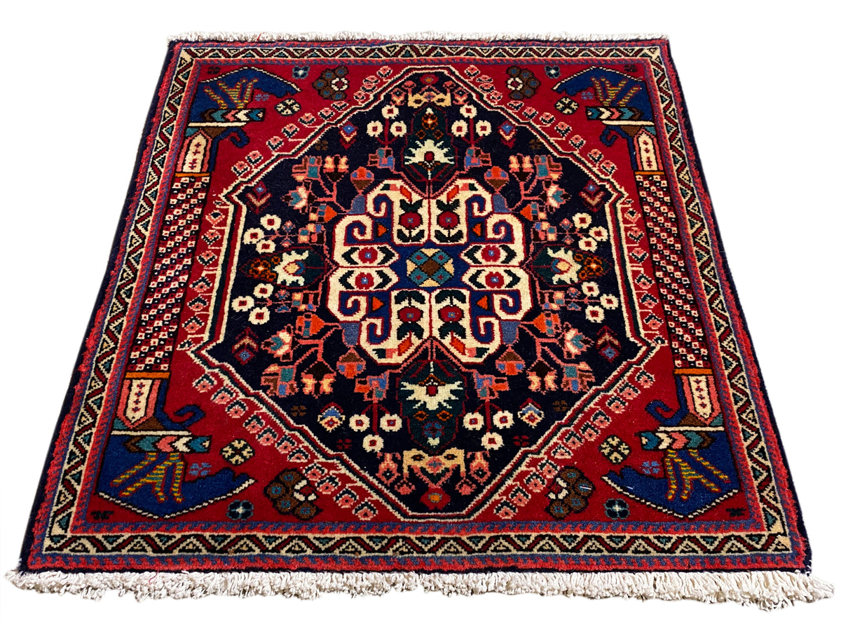 Tappeto Poshti 66x63 cm, blu scuro/rosso, motivo a medaglione con frange sui bordi