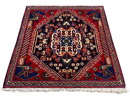 Tappeto Poshti 66x63 cm, blu scuro/rosso, motivo a medaglione con frange sui bordi