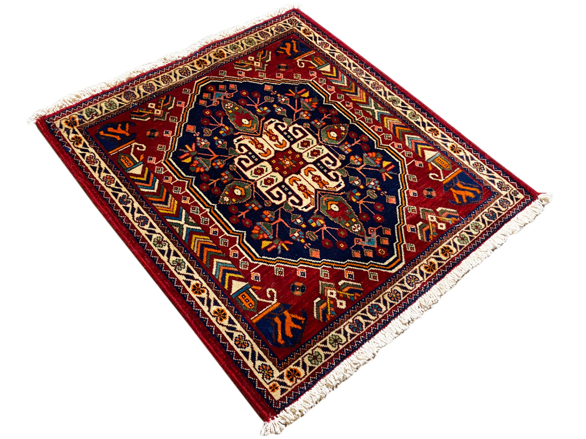 Tappeto 63x60 cm con motivo ornamentale geometrico, parte centrale blu e frange