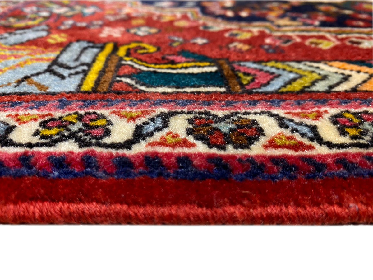 Tappeto Poshti 65x61 cm Primo piano del bordo: ornamenti rossi, blu e multicolore
